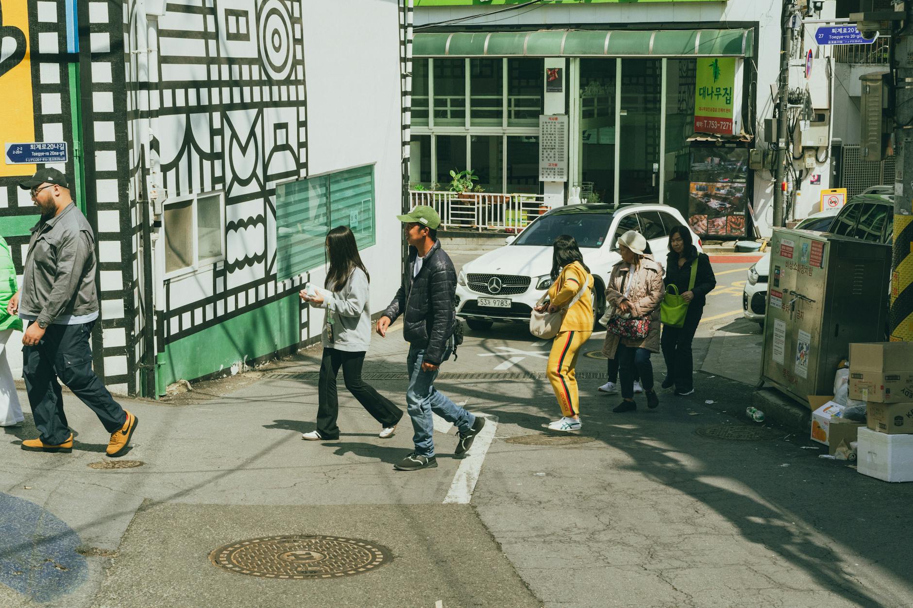 A bustling street scene in Seoul, capturing daily life and vibrant urban culture.